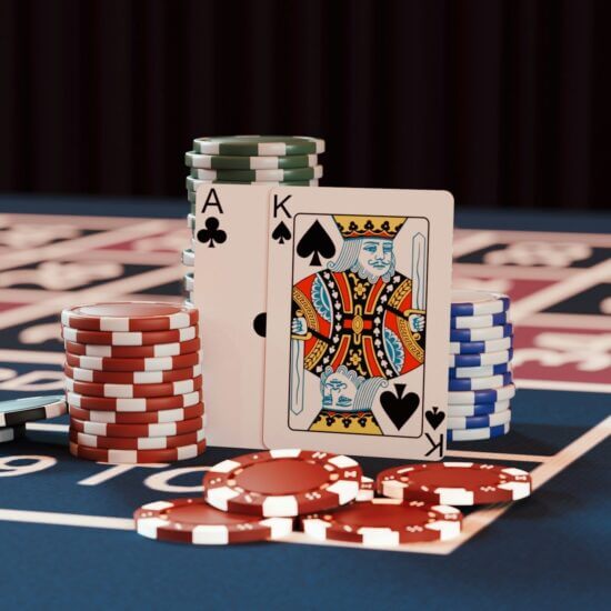 a casino table with poker chips and playing cards