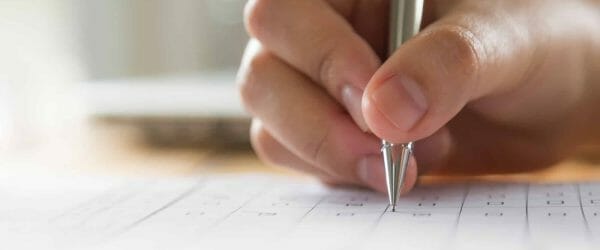 hand-writing-paper-with-pen