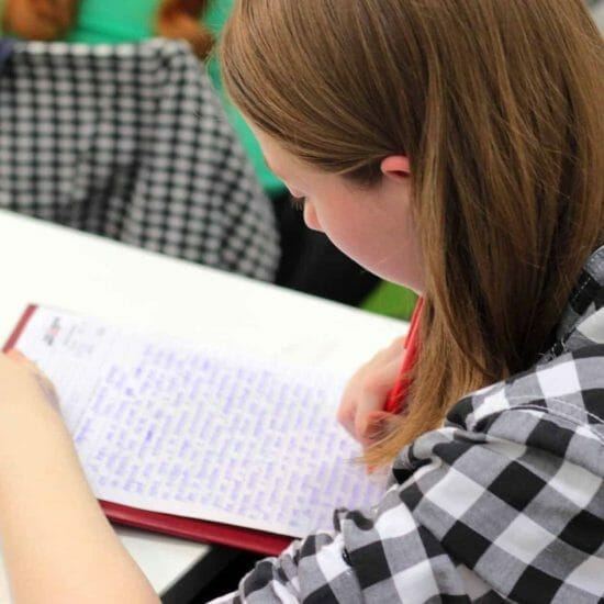 homework paper pen person