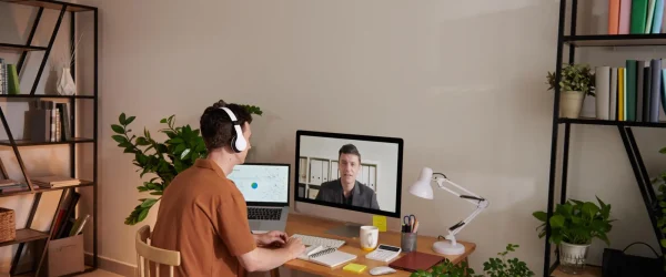man attending online meeting